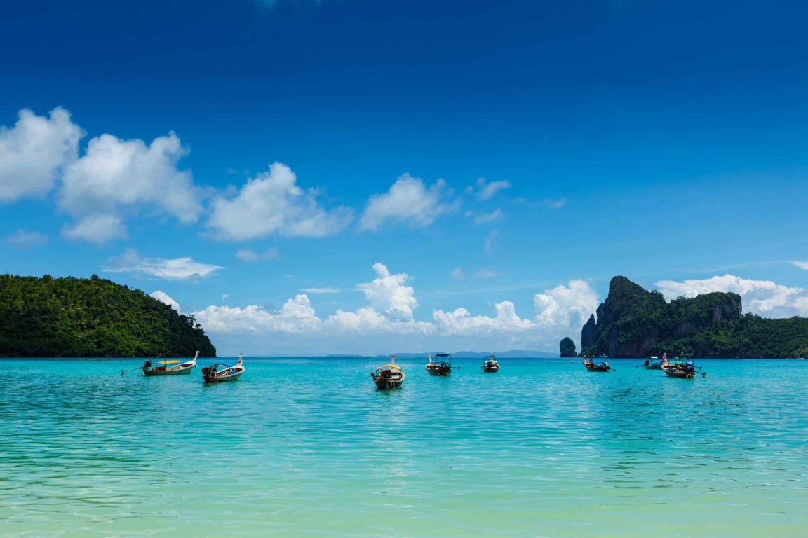 Long tail boats in bay. Phi Phi Island, Krabi, Thailand