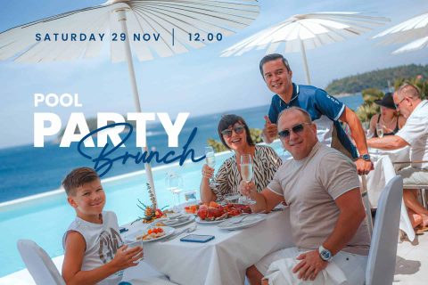 Smiling family celebrating with seafood and champagne at a luxurious pool party brunch, November 2025.
